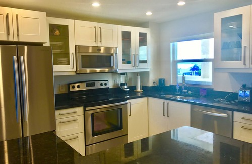 Sand Key Condo | Unit 502 2 waterfront balconies! Expansive white sand beach Harbor Light Tower