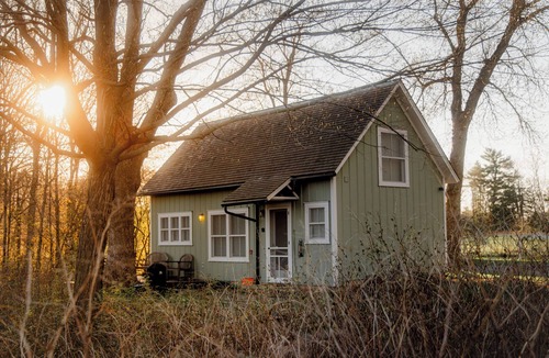 Almelund Cottage | Unity Farm: Three private cottages set across restored prairie and forest along the St. Croix River, with a barn and tennis courts.