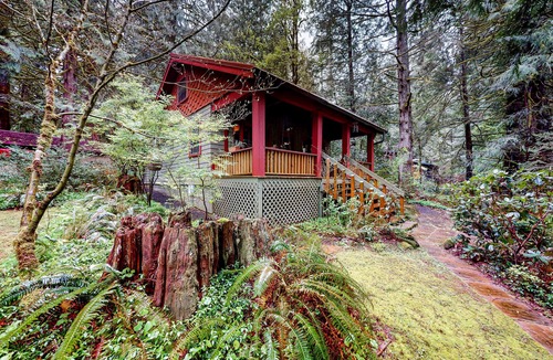 Marmot Apartment | Unwind in nature's embrace at a 1925 cabin with hot tub & river views