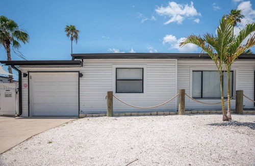 Madeira Beach Cottage | Unwind in Studio Cottage, Steps From the Beach, Heated Pool and a Short Walk to Johns Pass Village.