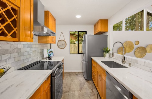 Rollingbay House | Updated beachfront home with private beach, water views, spacious deck, & W/D