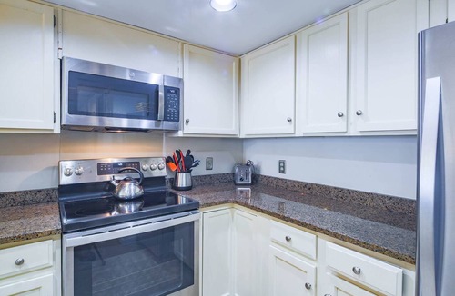 South Beach Condo | Updated & Gorgeous End Unit with Spectacular Views of Pool & Sound. South Beach Oasis Awaits you!
