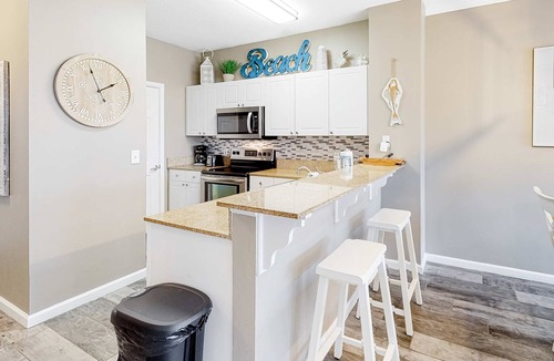 Frangista Beach Condo | Updated ground floor beachside condo with private beach access & patio