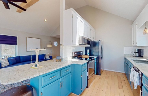 Livingston House | Updated lakefront home & studio with water views, hot tub, dock & game room