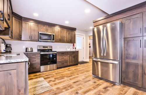 Manitowish Waters Cabin | Updated, tree-lined home on the snowmobile trail with gas fireplace & firepit