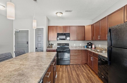 West Des Moines Apartment | Upgraded, Modern Retreat with Private Garage