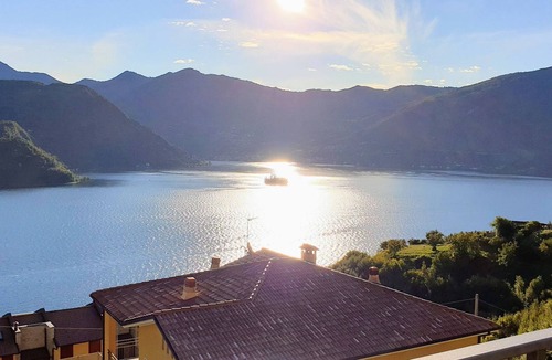 Tavernola Bergamasca Apartment | Vacation apartment with wonderful panoramic lake view, 2 terraces, pool, parking lot