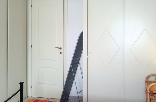 Lu Bagnu Apartment | Vacation apartment on the 1st floor with shared pool 500 m from the sea in Lu Bagno.