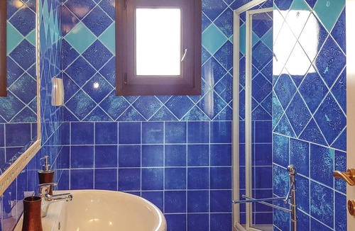 Lu Bagnu Apartment | Vacation apartment on the 1st floor with shared pool 500 m from the sea in Lu Bagno.
