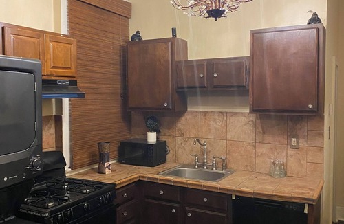 Uptown Historic District House | Victorian Historic Uptown One Bedroom on Parade Route with Queen Sofa Couch