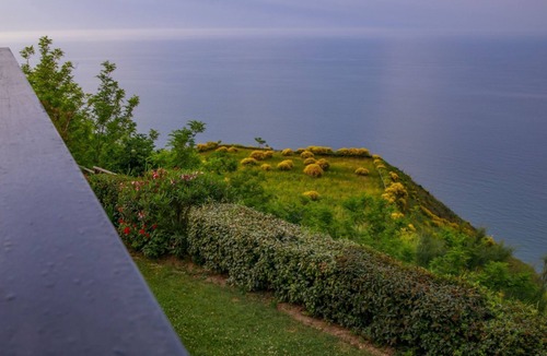 Fiorenzuola di Focara Villa | Villa with a pool, sunrise, and sunset over the sea