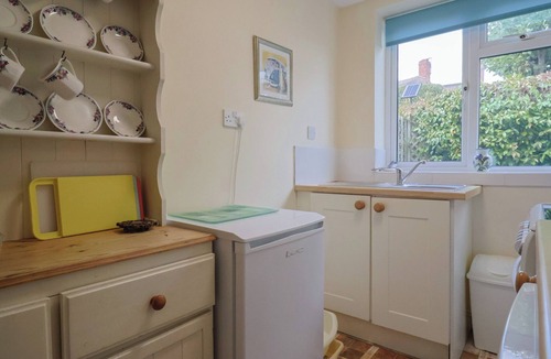 Bridport Cottage | VINE COTTAGE, pet friendly, with a garden in Burton Bradstock