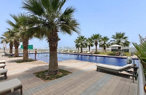 Dubai Apartment | Vogue Vacation Homes, Damac Hills Golf Gate near First Avenue Mall, Two Bedroom Apartment with Balcony and Vibrant Community View, Access to all Amenities