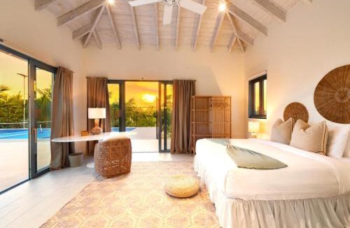 Caicos Islands Villa | Wakesurf Villa Waterfront Retreat with Dock Kayaks and Pool