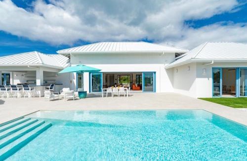 Caicos Islands Villa | Wakesurf Villa Waterfront Retreat with Dock Kayaks and Pool