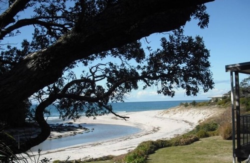 Whiritoa House | Walk straight onto the sand from the garden.