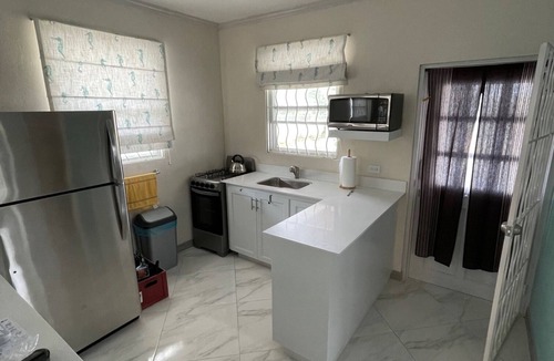 Atlantic Shores Cottage | Walk to Freights Bay surfing & Miami Beach with golfing nearby!