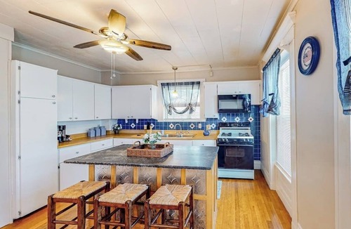 Colchester House | Warm & inviting retreat with a full kitchen, gas fireplace, & furnished patio