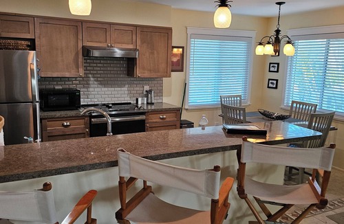 Palm Island Condo | Waterfront 2BR beach & lagoon retreat. Dock, pool, dog-friendly. Incommunicado!