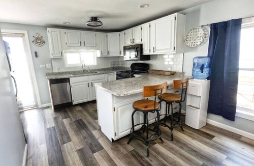 Solon Mills Cottage | Waterfront 2BR Nautical Cottage on Grass Lake - Hot Tub, Firepit & Year-Round Fun