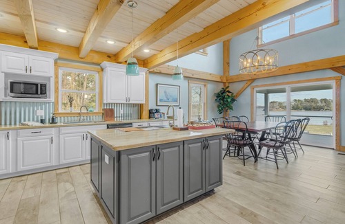 Wicomico Church House | Waterfront 4-bedroom homestead with pool, jacuzzi, and dock access. Sleeps 11!