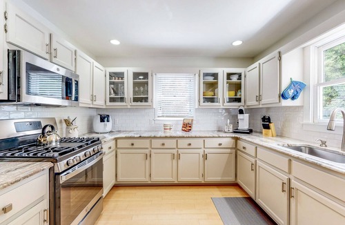 Salisbury House | Waterfront allergy-free home with 40-foot fishing dock, canoe, home theater