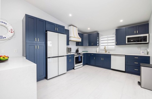 Pirates Cove House | Waterfront bayside oasis w/dock, pool, outdoor kitchen, pizza oven & fun