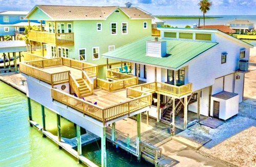 San Luis House | Waterfront Canal Bay & Beach Home with Fishing, Boat Dock, Tiki Bar & More!