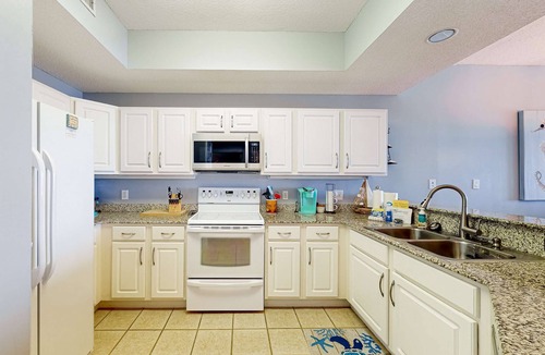 Orange Beach Condo | Waterfront condo with shared pool, tennis, & sauna - near the beach