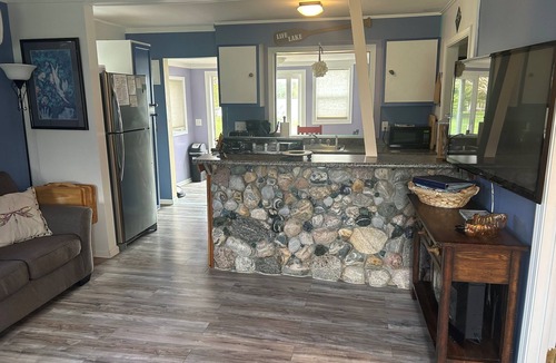 Elk Rapids House | Waterfront cottage in Elk Rapids on Bass Lake. Firepit, dog ok