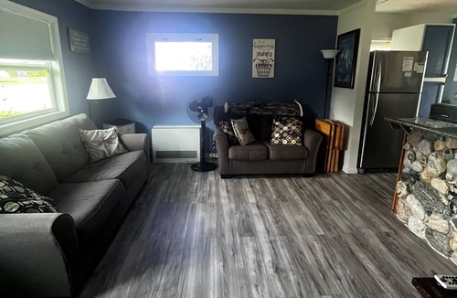 Elk Rapids House | Waterfront cottage in Elk Rapids on Bass Lake. Firepit, dog ok