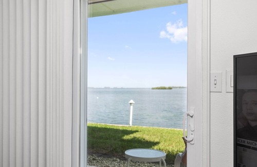 Dunedin Condo | Waterfront Escape! Heated Pool, BBQ, Clubhouse & Pier – Dolphins & Sunsets from Your Private Porch!