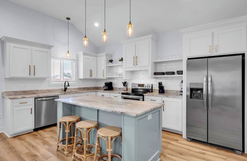 Shoreline Park House | Waterfront Escape in Bay STL with dock,pickleball, ping pong, basketball & more!