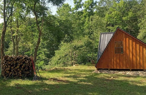 Mount Storm Cabin | Waterfront Glamping Cabin On Private Blue Water Mountain Top Lake