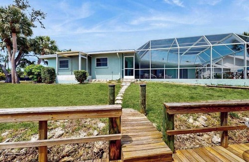 Sorrento Shores House | Waterfront home with pool, dock accessible to Gulf, dog friendly with AC & WD