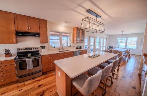 Topping House | Waterfront Home with pool dock gameroom and kayaks