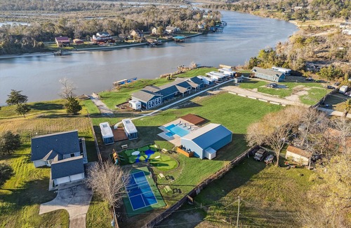 Highlands House | Waterfront Home with Boat Launch and Dock, Pool & basketball/pickleball court mini golf, playground