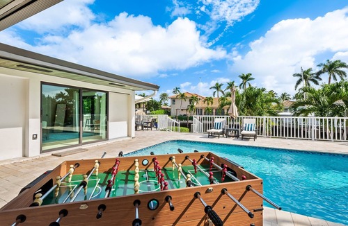 Lighthouse Point House | Waterfront~HUGE Heated Pool~Open Floor Plan~BIG Patio with Lots of Seating + Dock~Near Beaches