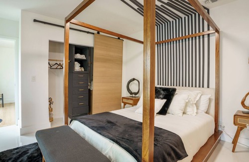 North Central Hollywood House | Waterfront Master bedroom.