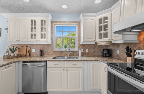 Palm Harbor House | Waterfront Oasis - Heated Pool, Kayaks + Game Room