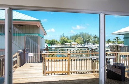 Marathon House | Waterfront Remodeled Home w/Private 35’ Boat Dock - at the foot of the iconic 7-Mile Bridge. Cozy house, water views, outdoor entertaining, private XL hot tub, walk to Sunset Grill for pool. Perfect for fishing, boaters, divers & sunset lovers.
