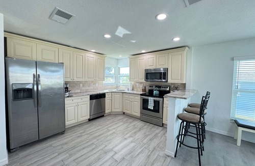 Oakland Hills House | Waterfront Retreat 4 BR, 3 BA screened & heated pool, gorgeous canal views