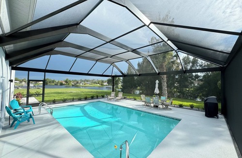 Oakland Hills House | Waterfront Retreat 4 BR, 3 BA screened & heated pool, gorgeous canal views