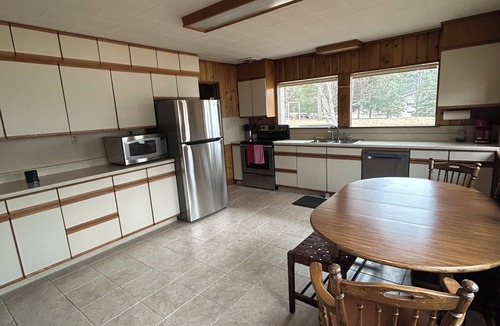 Park Rapids House | Waterfront right in town. 200 ft. of clear shoreline. On an acre lot.