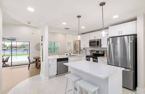 Harbor Hills House | Waterfront, Screened Lanai, Pool, King Beds, BBQ