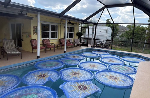Venice Groves House | Waterfront single home rental with private lanai, heated pool, and hot tub!