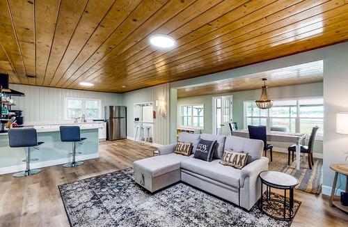 Candler House | Waterfront stay with a dock, firepit, grill, sunroom, separate studio, W/D, & AC