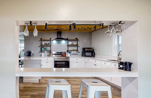 Candler House | Waterfront stay with a dock, firepit, grill, sunroom, separate studio, W/D, & AC