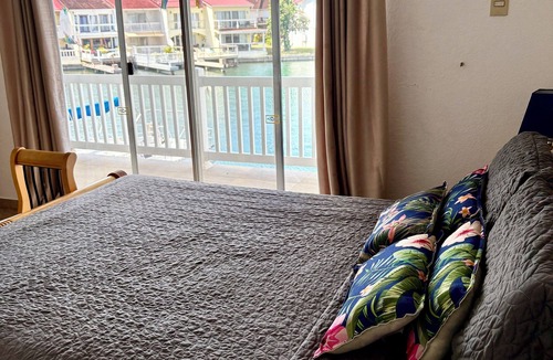 Jolly Harbour Villa | Waterfront two bed villa 3 mins walk to stunning Beach, air con and balcony