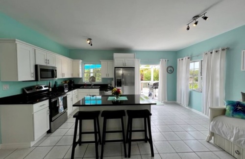 Cooper Jack Bay Settlement Villa | Waterfront Villa with Dockside Patio, Paddleboards & Pontoon Boat Rental option